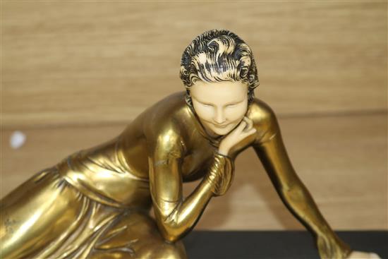 An Art Deco lady and dog figure group, on black marble base width 45cm height 19cm